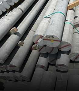 Logs of steel stacked in a scrap yard